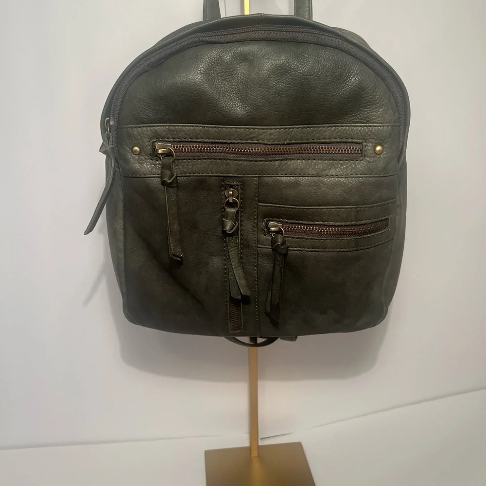 Green Backpack with Rugged Design and Leather Material